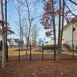 American Heritage Fence - Beautiful dog-friendly aluminum fence in family Wake Forest neighborhood with double-drive gate