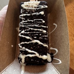Oreo with chocolate dip, Oreo crumbs, and white chocolate drizzle
