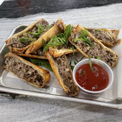 The BankBar - Cheesesteak roll with cooper cheese and spicy ketchup.