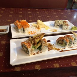 Spider roll, Honolulu roll and the true love roll, partially eaten Spider roll, Honolulu roll and the true love roll, partially eaten