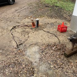 JK Pump & Well Service - Sinkhole from not filling & compacting where he dug.