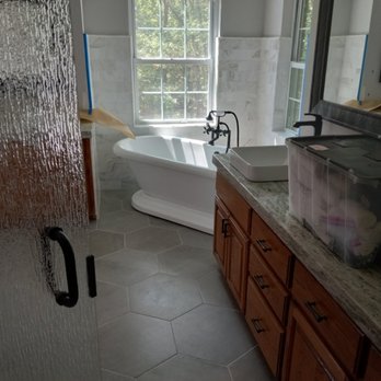 Shockwav3s Solutions Pro Service - a bathroom with a tub and a window - Handyman Near Me Shockwav3s Solutions Pro Service - a bathroom with a tub and a window - Handyman Near Me