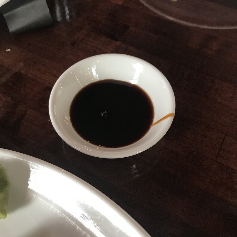 a plate of sushi and sauce