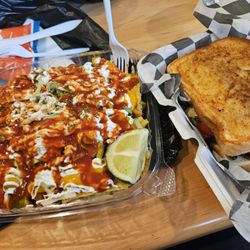 It’s A Must Cafe - Seafood nachos and steak melt.