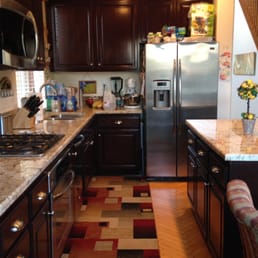 Kitchen cabinet refacing and granite installation. Kitchen cabinet refacing and granite installation.