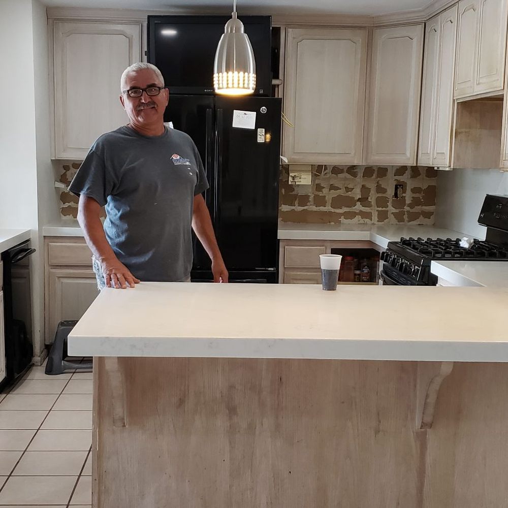 Summit Granite and Marble - Jaime after installing the counters and sink. - Countertop Installation Near Me