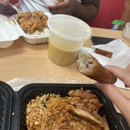 Pad Thai and garlic chicken,  Garlic Chicken and Curry Combo, fried rolls