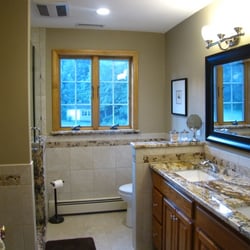 Proside Restoration & Remodeling - AFTER: A complete bathroom renovation with a custom shower pan and detailed finish work