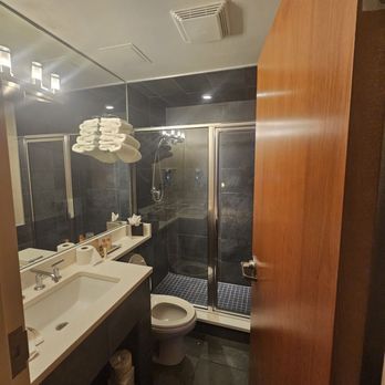 Harborside Inn - A view of the bathroom, with spacious, glass enclosed shower - Hotels Near Me - Boston, Massachusetts