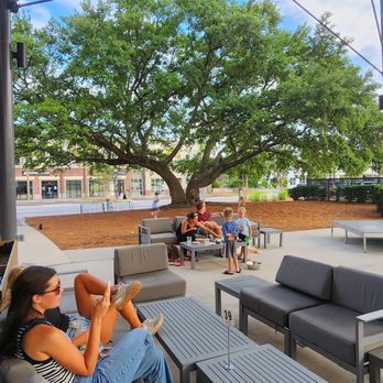 New Realm Brewing - Outdoor plaza with seating in front of restaurant - Brewpubs Near Me - Charleston, South Carolina New Realm Brewing - Outdoor plaza with seating in front of restaurant - Brewpubs Near Me - Charleston, South Carolina
