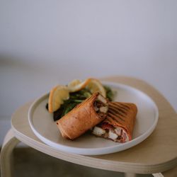 Simply Brew Cafe - Tomato flour tortilla layered with homemade chipotle mayo, filled with tender grilled chicken, peppers, onions, and melted provolone.