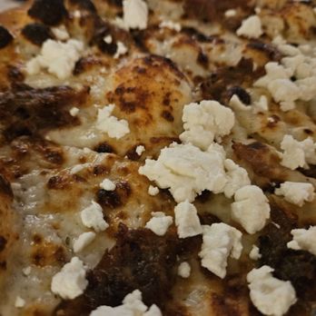 Koloa Pizza Kitchen + Bar - Closeup of the goat cheese and pork pizza. - Pizza Near Me - Koloa, Hawaii Koloa Pizza Kitchen + Bar - Closeup of the goat cheese and pork pizza. - Pizza Near Me - Koloa, Hawaii