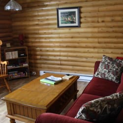 Irwin Lake Chalets - Salon avec jeux de société et foyer au bois