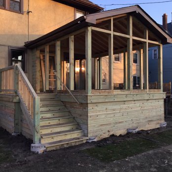 Sonin Construction - a porch with steps leading up to a covered porch - General Contractors Near Me - Forest Park, Illinois Sonin Construction - a porch with steps leading up to a covered porch - General Contractors Near Me - Forest Park, Illinois