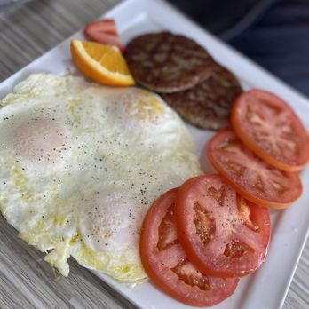 Biscuits And Gravy - Triple egg and sausage patties plated with tomatoes. - Salad Near Me - Clawson, Michigan Biscuits And Gravy - Triple egg and sausage patties plated with tomatoes. - Salad Near Me - Clawson, Michigan