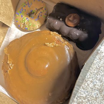Legendary Doughnuts - A huge plain cinnamon roll topped w/maple glaze, dense brownie, and simple but $3 doggie cookie. About $15 - Donuts Near Me - Auburn, Washington