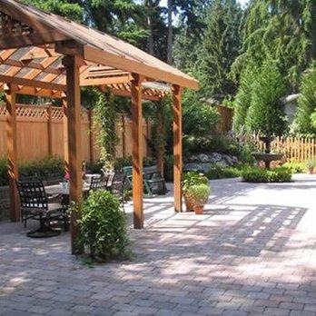 Schmidt's Landscaping - a patio with a pergolated roof - Landscaping Near Me - Sheboygan Falls, Wisconsin Schmidt's Landscaping - a patio with a pergolated roof - Landscaping Near Me - Sheboygan Falls, Wisconsin