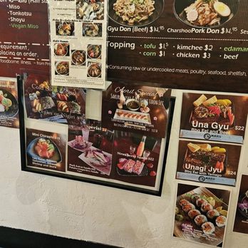 Maru Plus - Additional menu - A wall with various sushi menu images, including nigiri, rolls, and special sets, with prices and descriptions. - Japanese Near Me - Tucson, Arizona