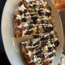 Daniel & The Dog - Flat bread with birria meat.