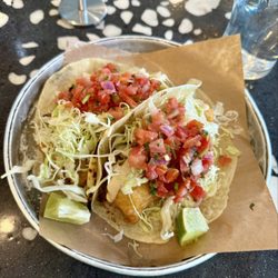 Love the paper thin tortilla that's nicely charred. perfect taco for baja fish, cabbage & tomato salsa. bigger lime pieces would be better.