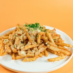 Greek Garlic Fries at Santorini's West Bountiful: A generous portion of garlic and feta piled high. Served with Santorini's House Dressing.