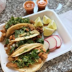 Don Julio's Tacos - Pastor and chicken tacos. 4 for $10