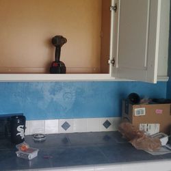 Cabinets To Go - First wall cabinet being installed by myself