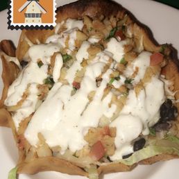 Taco Salad with fish and shrimp, beans, rice, lettuce, pico de Gallo, and ranch dressing in a crispy fried shell Taco Salad with fish and shrimp, beans, rice, lettuce, pico de Gallo, and ranch dressing in a crispy fried shell