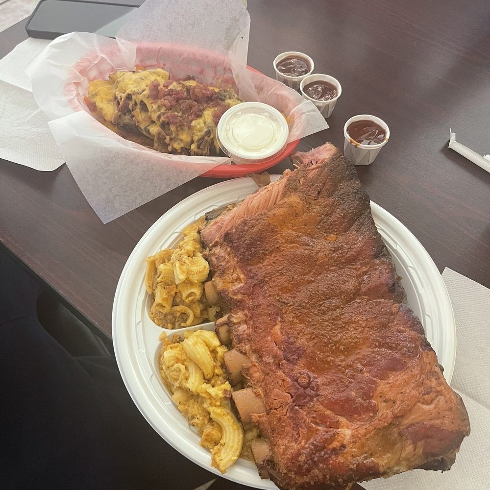 Ribs and spicy Mac with loaded potato