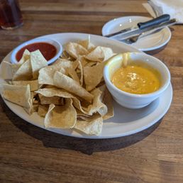 Chips and queso dip, yummy!  The other one is our plates the one with the salad is mine.