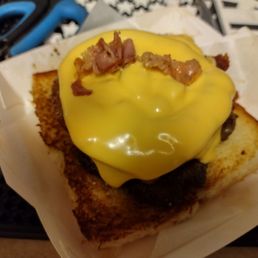 Ya that's my cheese on top I could barely find their cheese look how small those patties are huh all that bread