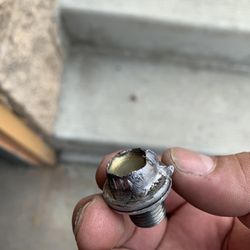 G & M Auto Repair - Another view of this soft metal oil drain plug. Bolt extractor ate it and just kept rounding off.