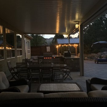 Sierra Nevada Builders - a patio with patio furniture - General Contractors Near Me