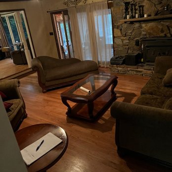 Outlook Flooring - a living room with a stone fireplace - Carpet Installation Near Me - Monroe, North Carolina Outlook Flooring - a living room with a stone fireplace - Carpet Installation Near Me - Monroe, North Carolina