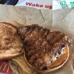 a fried chicken sandwich and a half eaten sandwich a fried chicken sandwich and a half eaten sandwich