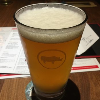 Earls Kitchen + Bar - Glass of Rhino beer~ - Canadian (New) Near Me - Vancouver, British Columbia Earls Kitchen + Bar - Glass of Rhino beer~ - Canadian (New) Near Me - Vancouver, British Columbia