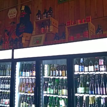 Schilling Cider House - Cider fridges with schilling brand products on top as decoration - Bars Near Me - Seattle, Washington