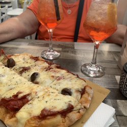 BAR Giacalone di Antonino Cascio & C.sas - Pizza and Aperol Spritz on the patio.