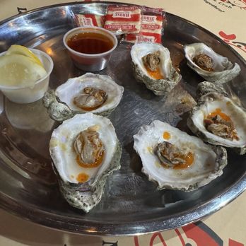 Mr. & Mrs. Crab Juicy Seafood & Bar - Steamed oysters drizzled with house Mr. & Mrs. Crab Special Mild Seasoning - Seafood Near Me - Davie, Florida