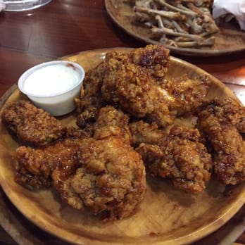 Hooters - here is a an order of wings! You can keep ordering and try out all the flavors! - American Near Me - West Springfield, Massachusetts