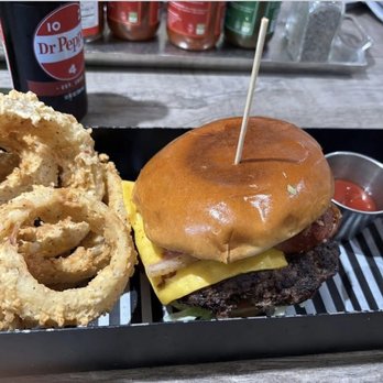 Little Joe’s Farmstead - Hamburger in a bun with Onion rings - Burgers Near Me - Argyle, Texas Little Joe’s Farmstead - Hamburger in a bun with Onion rings - Burgers Near Me - Argyle, Texas