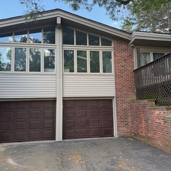 Elite Paint & Restoration - Garage doors painted to look like wood stain. - Painters Near Me