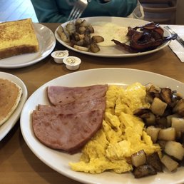 "Sunset super" 3 eggs. Ham. Home fries and pancakes.  "French connection" 3 eggs. Bacon. Home fries and French toast.