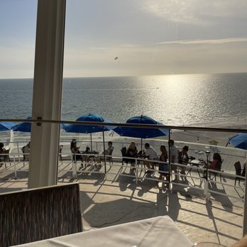 Spinners Rooftop Grille - Downstairs tables and lounge - Lounges Near Me - St. Pete Beach, Florida Spinners Rooftop Grille - Downstairs tables and lounge - Lounges Near Me - St. Pete Beach, Florida