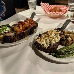 prime rib & prawns with baked potato + ribeye with blue cheese crust and veggies