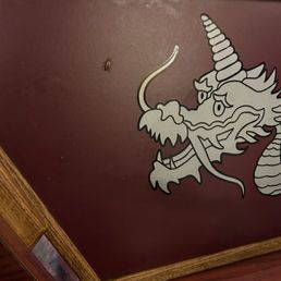 Booth divider, during business hours, lunchtime. Actual cockroach on his way to spread nastiness throughout a once respected establishment.