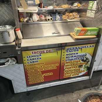 Tacos La Guera - This counter has all the salsas and toppings underneath the lid. You can bring your food once you get it around the table - Mexican Near Me - Los Angeles, California Tacos La Guera - This counter has all the salsas and toppings underneath the lid. You can bring your food once you get it around the table - Mexican Near Me - Los Angeles, California