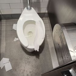 The back bathroom is filthy with toilet paper