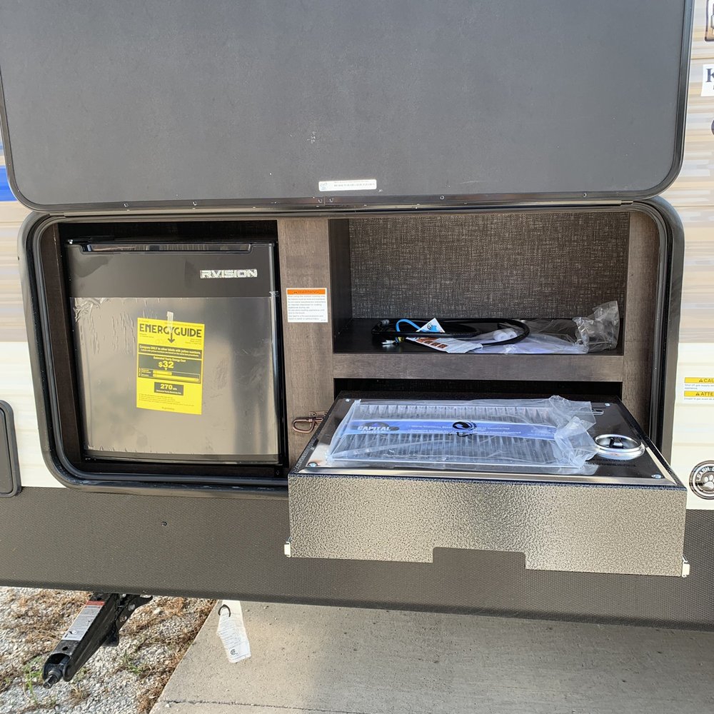 Ketelsen RV - Outdoor kitchen comes equipped with a propane grill not the typical burner stoves - RV Repair Near Me - De Soto, Iowa