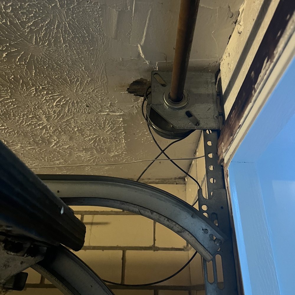 Above & Beyond Door Systems - Left side cable detaching from pulley - Garage Door Services Near Me Above & Beyond Door Systems - Left side cable detaching from pulley - Garage Door Services Near Me